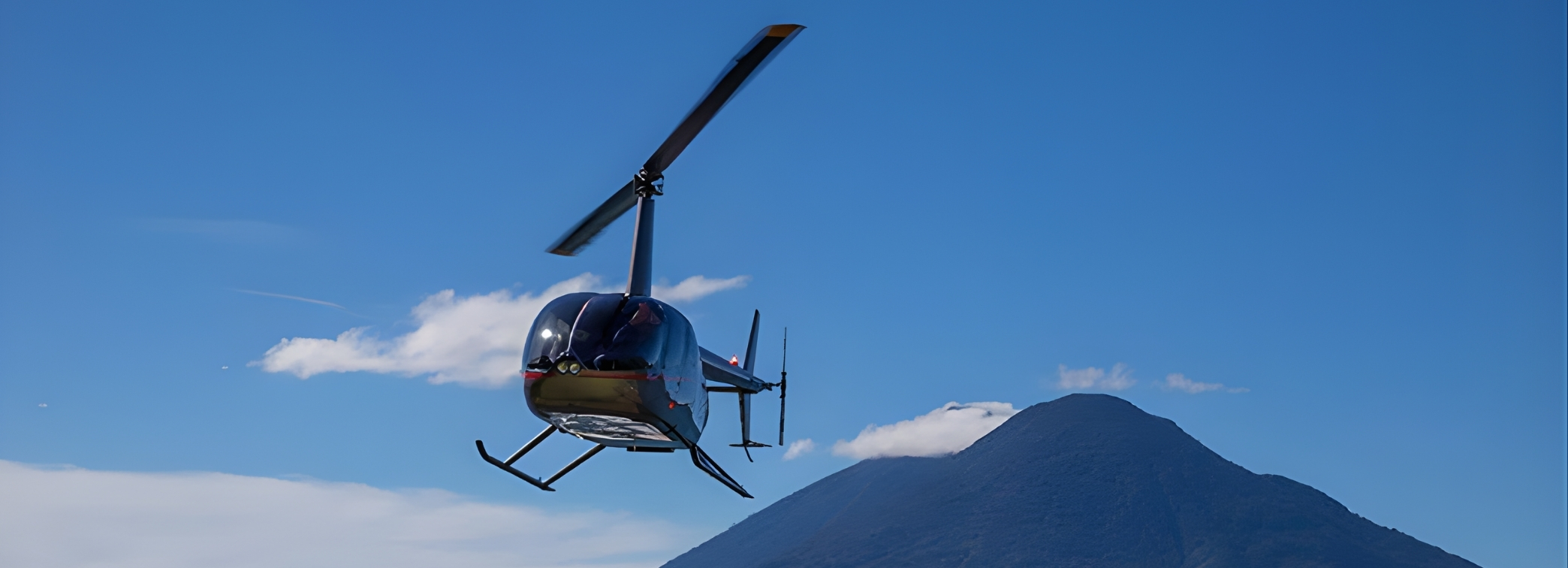 Private helicopter flying over Agua and Fuego volcanoes near Antigua Guatemala book one stop or the full tour