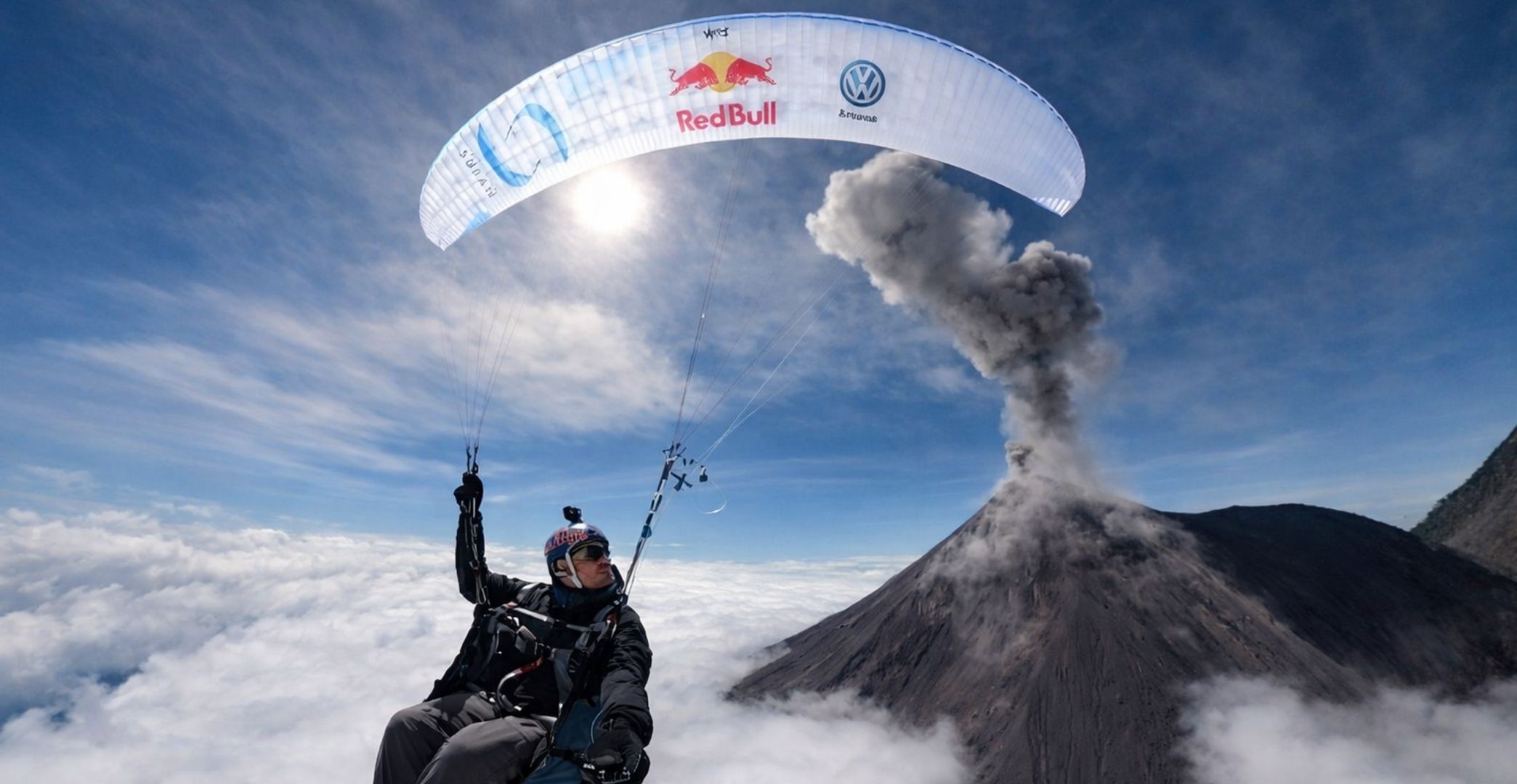 Tandem paragliding flight over Antigua Guatemala with Agua and Fuego volcanoes in the background — book your tour with Cyman Travel