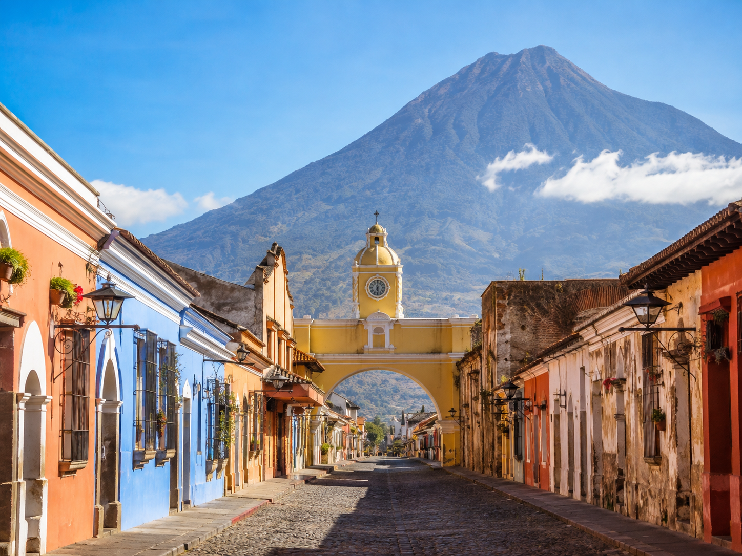 Antigua Guatemala colonial city with Volcán de Agua in the background during dry season clear skies